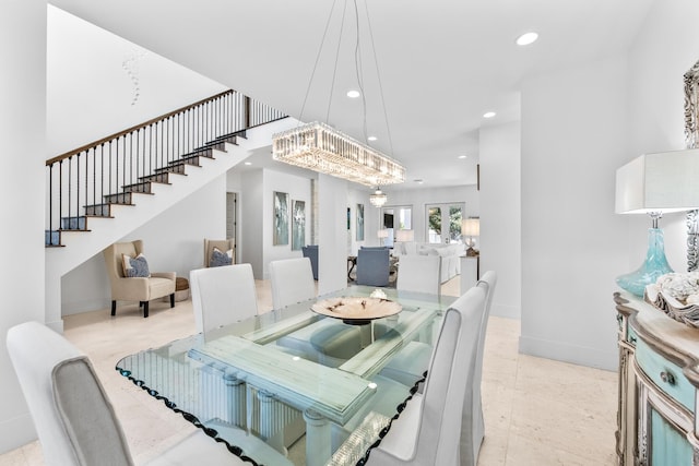 dining room with baseboards, stairway, and recessed lighting