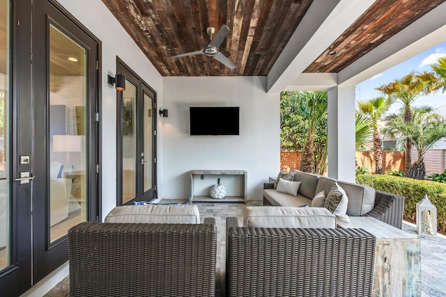 view of patio / terrace with ceiling fan, an outdoor hangout area, and fence