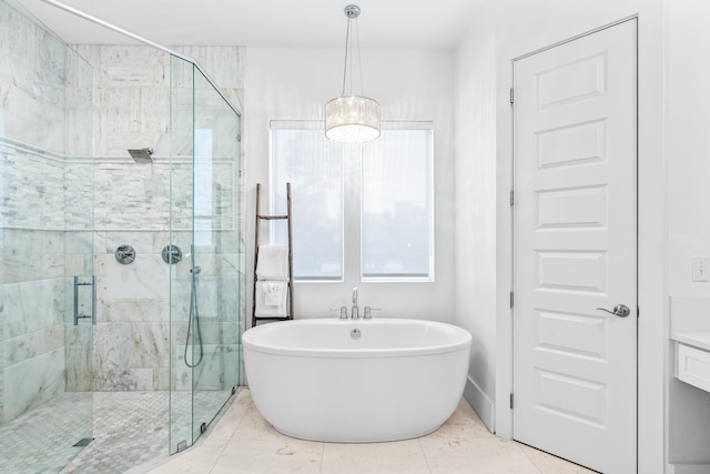 full bath with a freestanding bath, a stall shower, and tile patterned floors