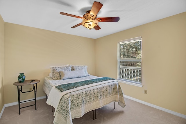 8840 Sand Pine Dr, Navarre, FL 32566 - carpeted bedroom featuring multiple windows, a ceiling fan, and baseboards