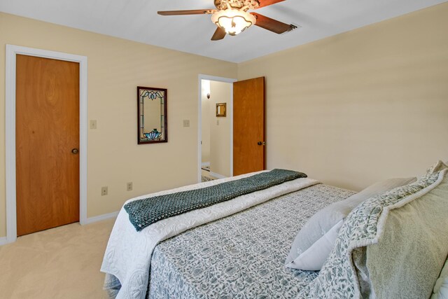 8840 Sand Pine Dr, Navarre, FL 32566 - bedroom with light carpet, ceiling fan, visible vents, and baseboards