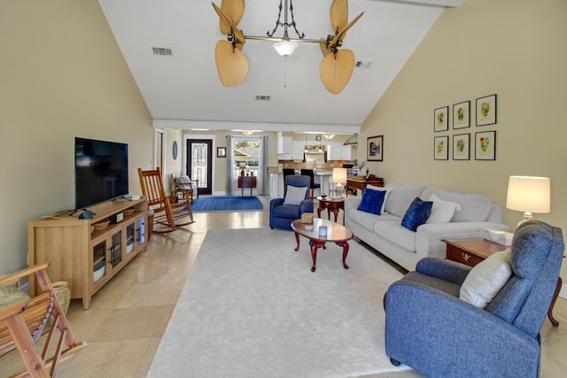 8840 Sand Pine Dr, Navarre, FL 32566 - living room with high vaulted ceiling, light tile patterned floors, and visible vents