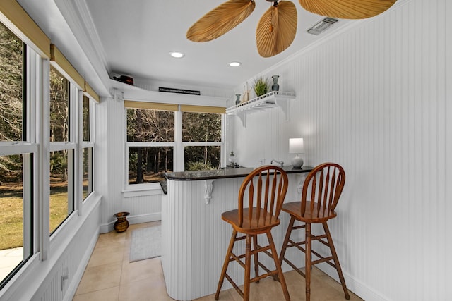 8840 Sand Pine Dr, Navarre, FL 32566 - bar with light tile patterned floors, crown molding, visible vents, and recessed lighting