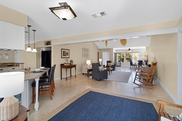 8840 Sand Pine Dr, Navarre, FL 32566 - interior space with lofted ceiling, visible vents, a ceiling fan, light tile patterned flooring, and baseboards