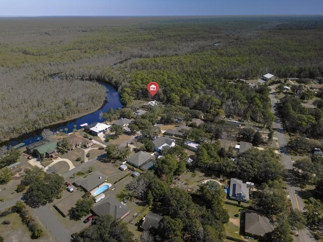 8840 Sand Pine Dr, Navarre, FL 32566 - birds eye view of property featuring a water view and a view of trees