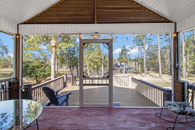 8840 Sand Pine Dr, Navarre, FL 32566 - unfurnished sunroom with lofted ceiling