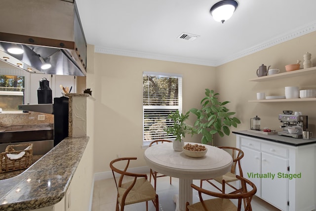 8840 Sand Pine Dr, Navarre, FL 32566 - dining space featuring visible vents, crown molding, and baseboards