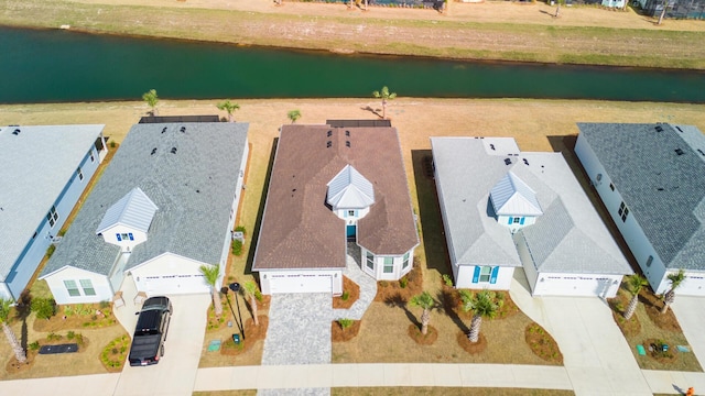 aerial view featuring a residential view and a water view