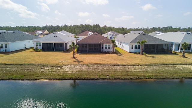 bird's eye view with a water view and a residential view
