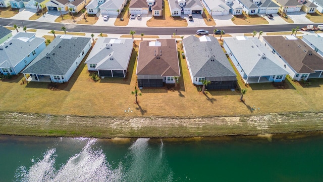 bird's eye view featuring a residential view and a water view