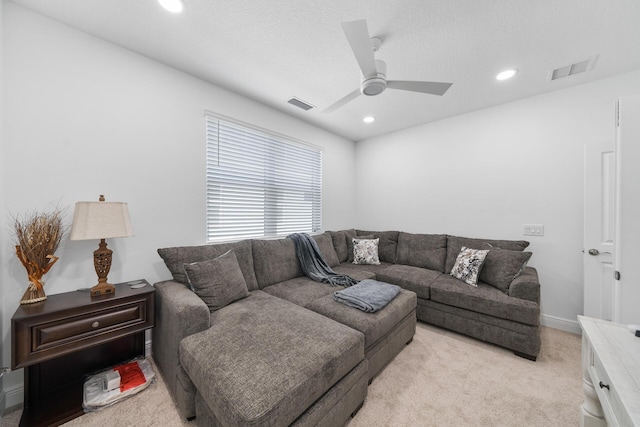 living room featuring visible vents, a ceiling fan, light colored carpet, and recessed lighting