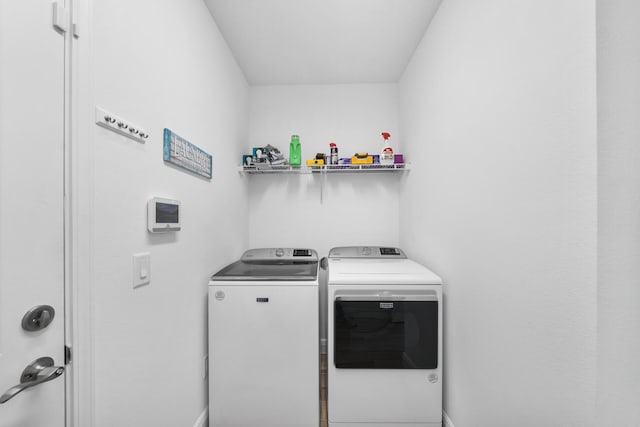 laundry room with independent washer and dryer and laundry area