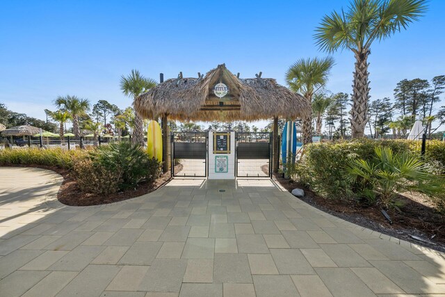 surrounding community featuring fence and a gate