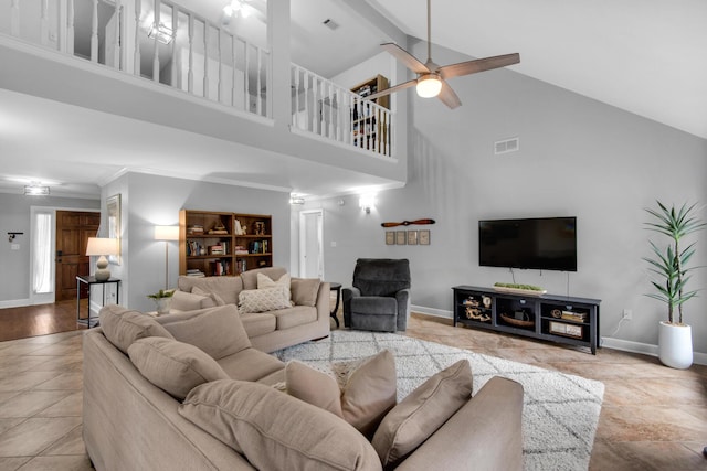 living room featuring a ceiling fan, visible vents, beamed ceiling, and baseboards