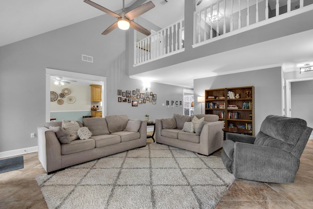 living area featuring a ceiling fan, visible vents, crown molding, and baseboards