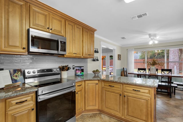 kitchen featuring french doors, stainless steel appliances, visible vents, backsplash, and a peninsula