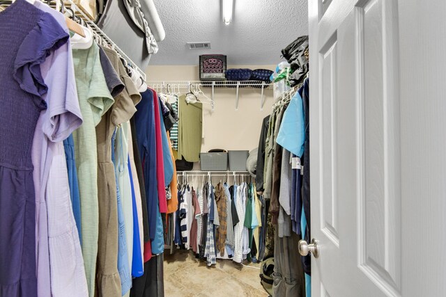 walk in closet with visible vents