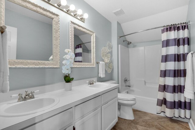 bathroom featuring double vanity, a sink, visible vents, and shower / tub combo with curtain