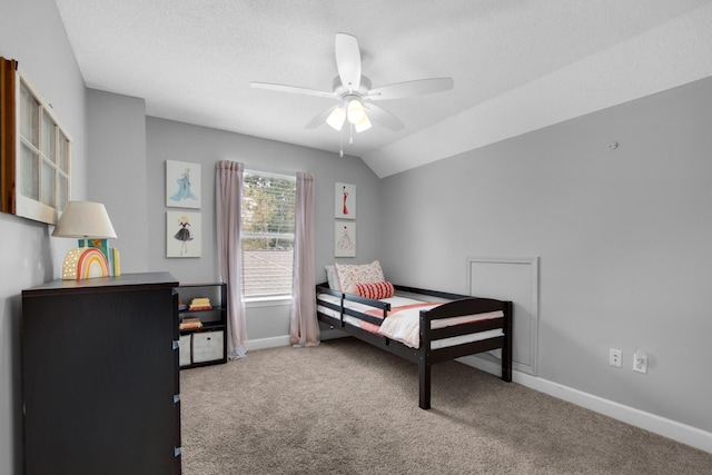 bedroom featuring carpet, lofted ceiling, a ceiling fan, a textured ceiling, and baseboards