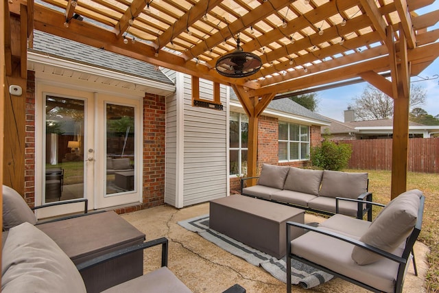 view of patio with outdoor lounge area, fence, and a pergola