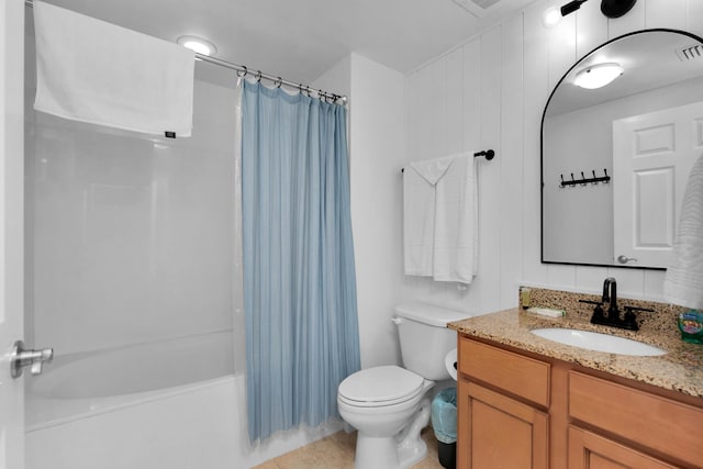 bathroom featuring toilet, tile patterned floors, shower / bath combination with curtain, and vanity