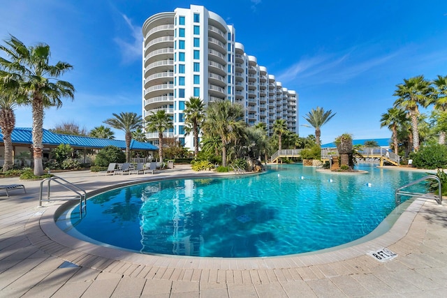 view of swimming pool with a patio