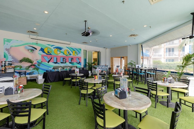 carpeted dining room featuring visible vents and recessed lighting