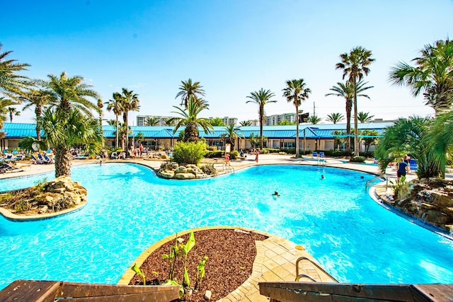 community pool with a patio area