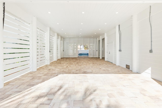 unfurnished living room with recessed lighting