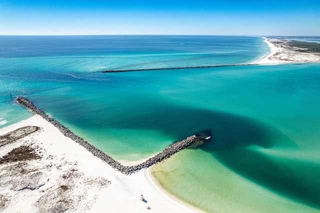 birds eye view of property featuring a view of the beach and a water view