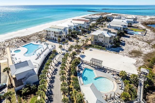 aerial view with a water view and a view of the beach