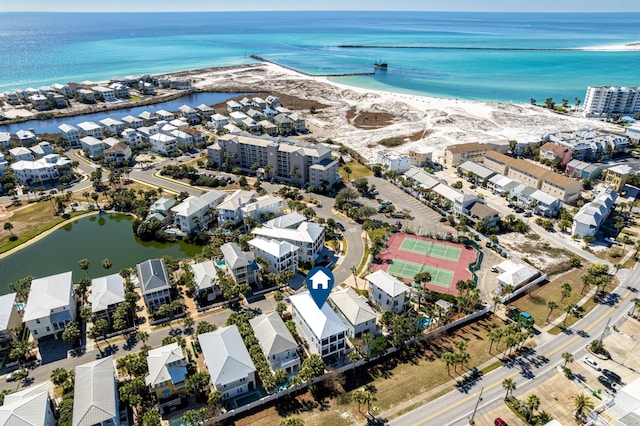 birds eye view of property featuring a water view and a view of the beach