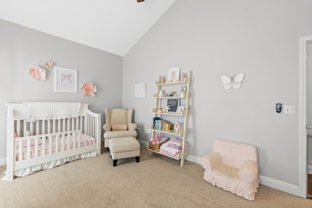 bedroom with carpet floors, a crib, high vaulted ceiling, and baseboards