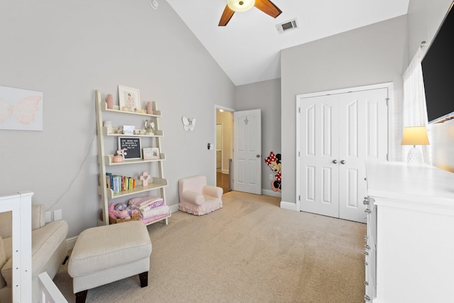 interior space with high vaulted ceiling, light colored carpet, a ceiling fan, baseboards, and visible vents