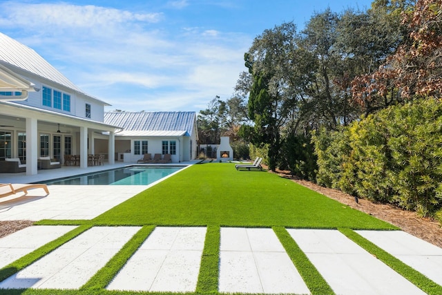 view of yard with an outdoor hangout area, a patio, and an outdoor pool