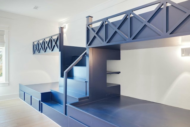 interior space with visible vents and wood finished floors