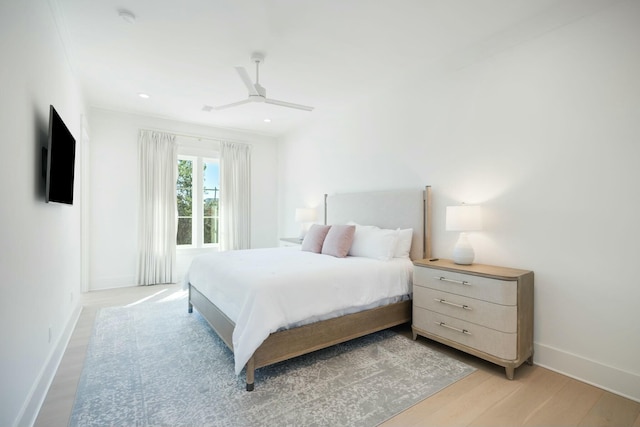 bedroom with light wood finished floors, ceiling fan, baseboards, and recessed lighting