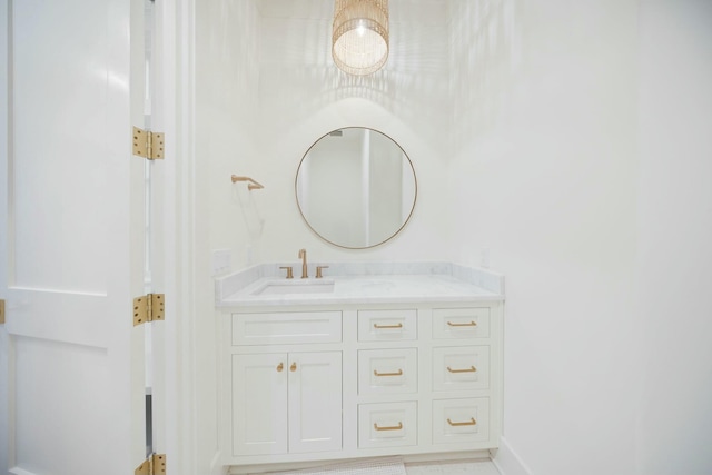 bathroom with vanity and baseboards