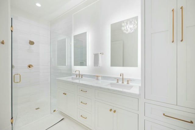 full bath with double vanity, a shower stall, and a sink