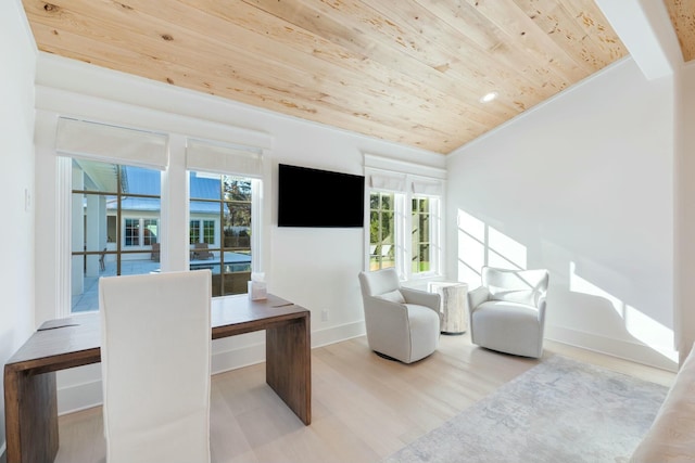 home office featuring lofted ceiling, wooden ceiling, baseboards, and wood finished floors