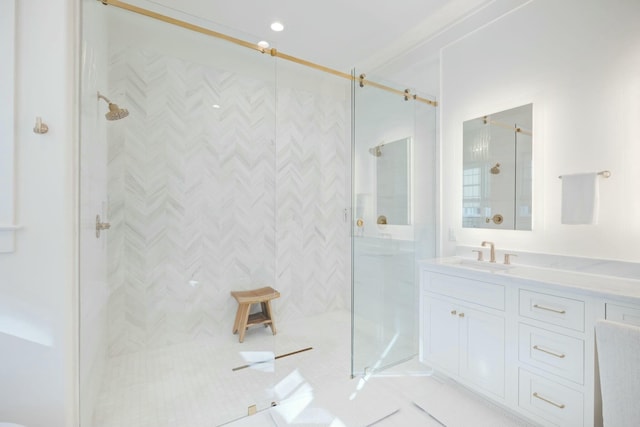 bathroom featuring a stall shower and vanity