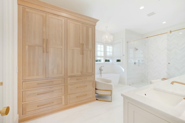 full bathroom featuring a marble finish shower, recessed lighting, a soaking tub, visible vents, and a sink