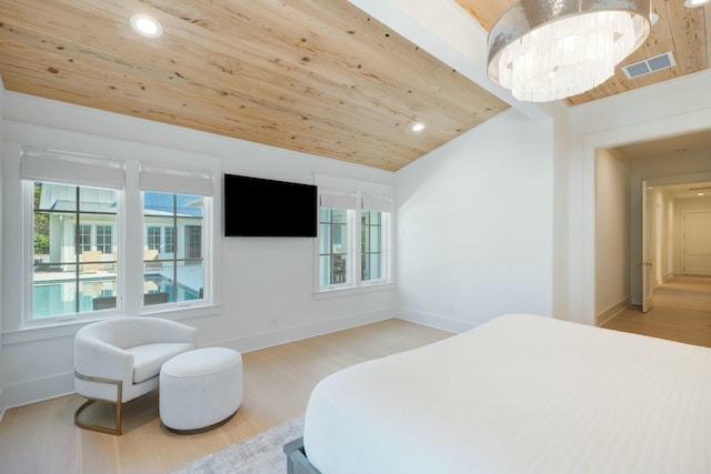 bedroom with visible vents, light wood-style floors, wood ceiling, vaulted ceiling, and baseboards