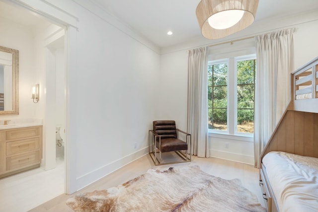 bedroom featuring ornamental molding, recessed lighting, ensuite bath, and baseboards