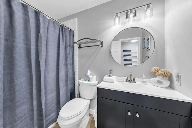 full bathroom with vanity and toilet