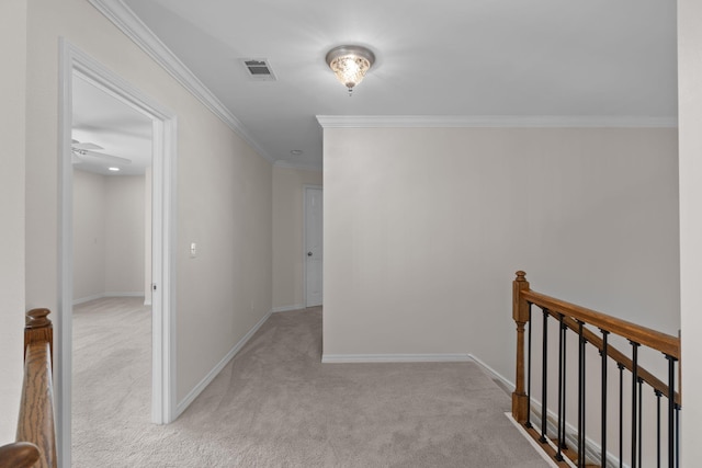 hallway with baseboards, light colored carpet, and an upstairs landing