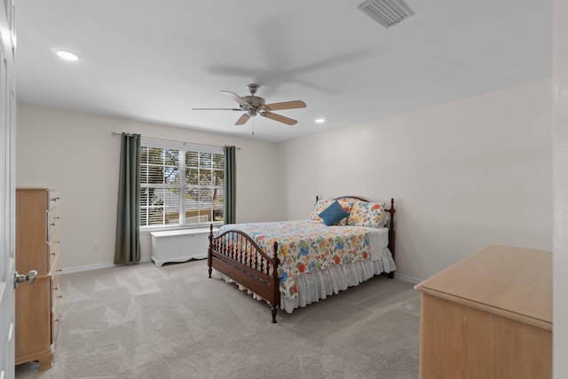 bedroom with recessed lighting, light carpet, visible vents, and baseboards