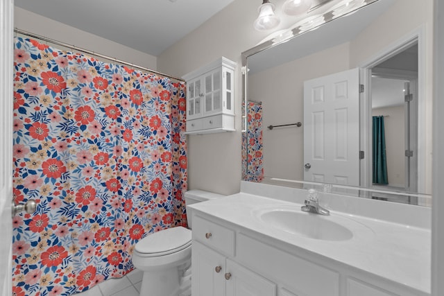 full bath featuring toilet, vanity, a shower with shower curtain, and tile patterned floors