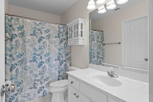 bathroom featuring tile patterned flooring, toilet, a shower with shower curtain, vanity, and visible vents