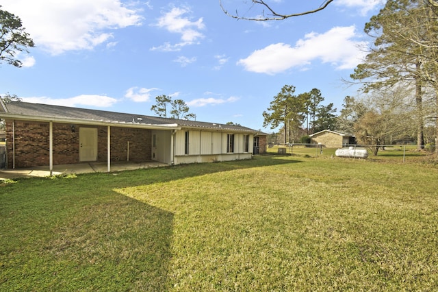 view of yard with fence and a patio